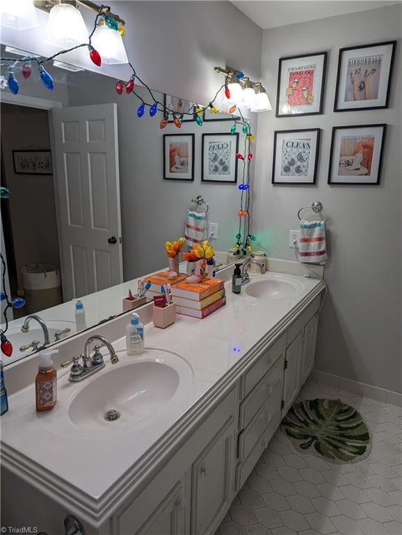 bathroom featuring tile patterned floors and vanity