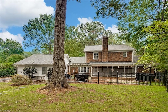 back of property with a patio and a yard