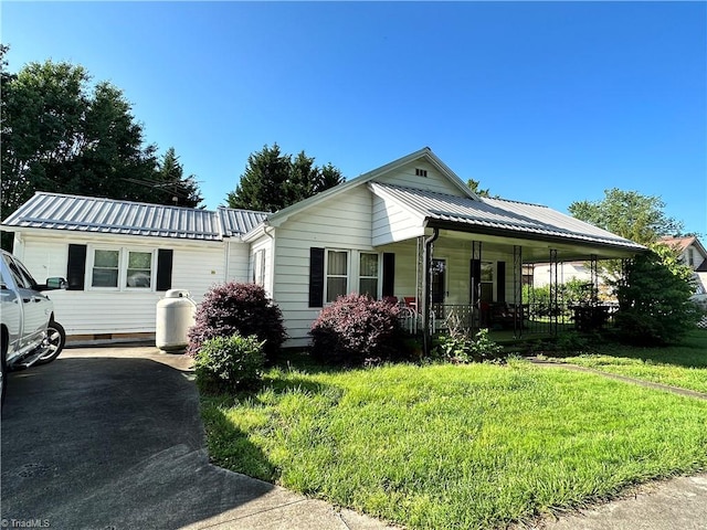 view of front of home with a porch and a front yard