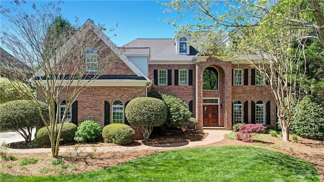 10 Sunfish Pt, Greensboro, NC 27455 - colonial house featuring brick siding and a front yard