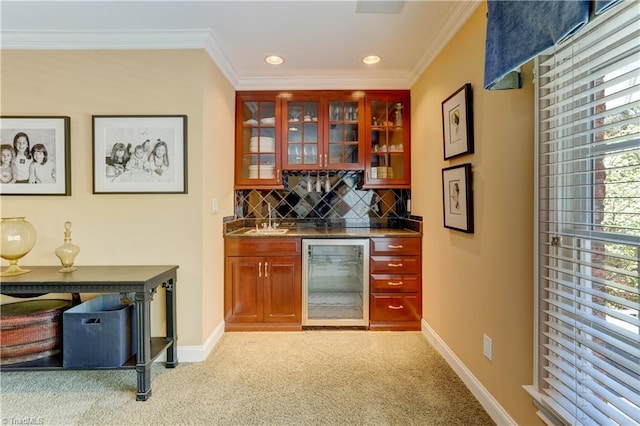 10 Sunfish Pt, Greensboro, NC 27455 - indoor bar featuring wine cooler, crown molding, baseboards, light carpet, and decorative backsplash