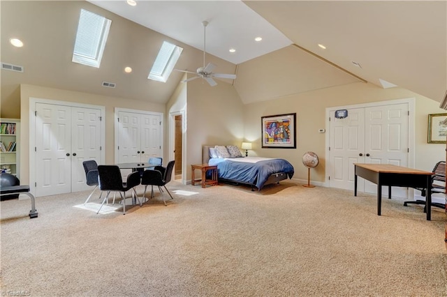 10 Sunfish Pt, Greensboro, NC 27455 - carpeted bedroom featuring high vaulted ceiling, two closets, a skylight, baseboards, and recessed lighting