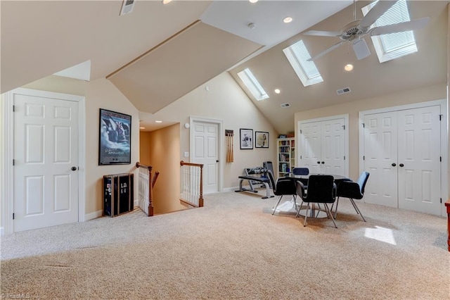 10 Sunfish Pt, Greensboro, NC 27455 - interior space featuring a skylight, carpet, ceiling fan, high vaulted ceiling, and baseboards