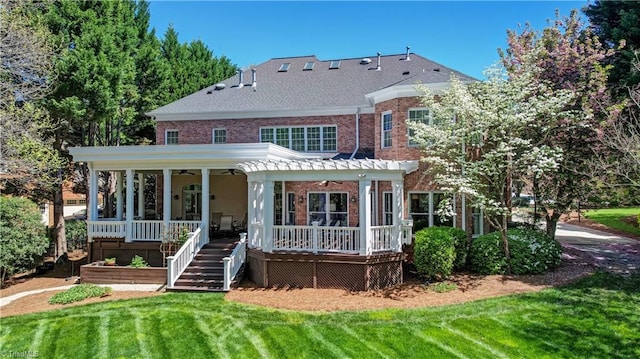 10 Sunfish Pt, Greensboro, NC 27455 - view of front facade featuring a ceiling fan, brick siding, and a front yard