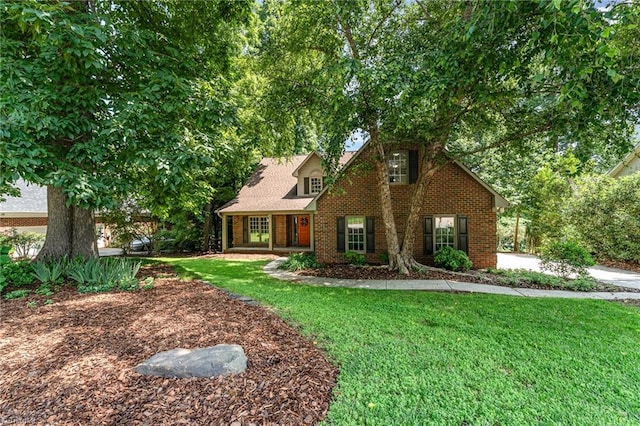 4335 Clovelly Dr, Greensboro, NC 27406 - view of front of home featuring a front yard and brick siding