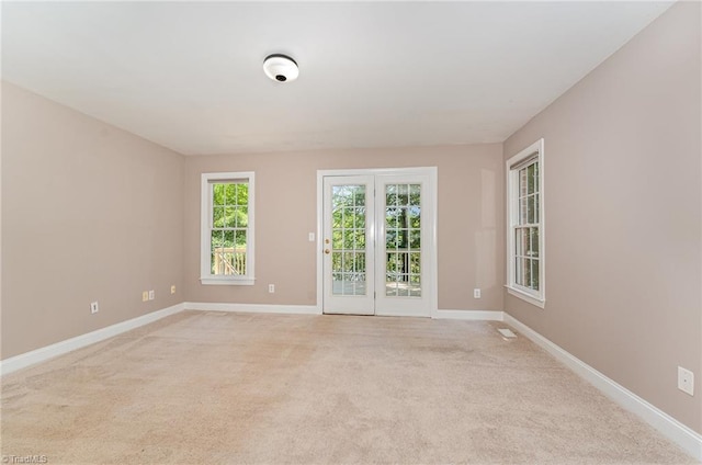 4335 Clovelly Dr, Greensboro, NC 27406 - spare room with baseboards and light colored carpet