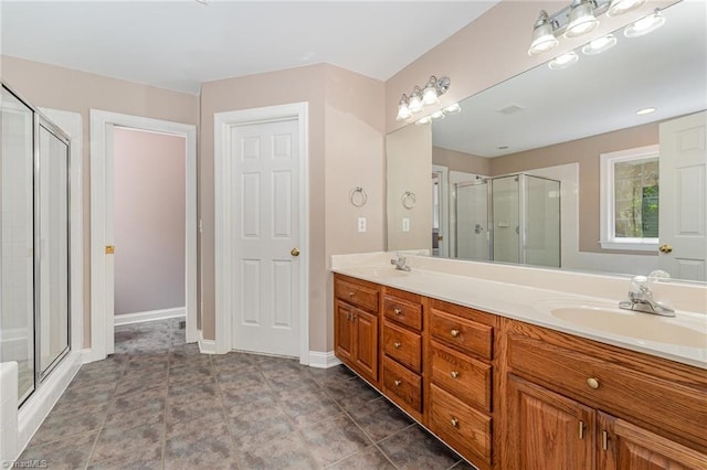 4335 Clovelly Dr, Greensboro, NC 27406 - bathroom with a stall shower and double vanity