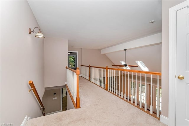 4335 Clovelly Dr, Greensboro, NC 27406 - stairway featuring a ceiling fan, a skylight, and carpet flooring