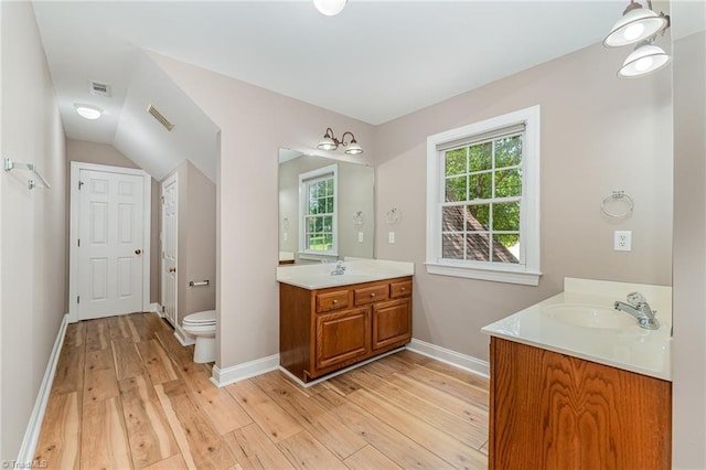 4335 Clovelly Dr, Greensboro, NC 27406 - bathroom featuring wood finished floors and two vanities