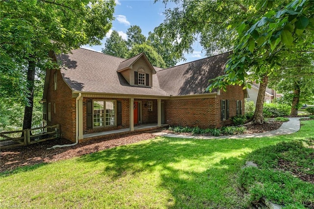 4335 Clovelly Dr, Greensboro, NC 27406 - cape cod-style house featuring brick siding and a shingled roof