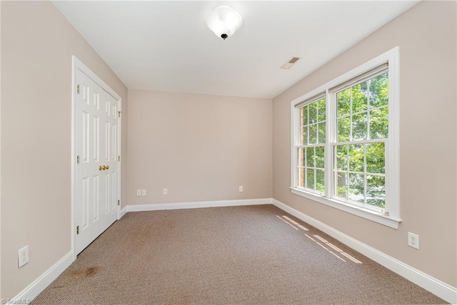 4335 Clovelly Dr, Greensboro, NC 27406 - spare room with carpet and baseboards