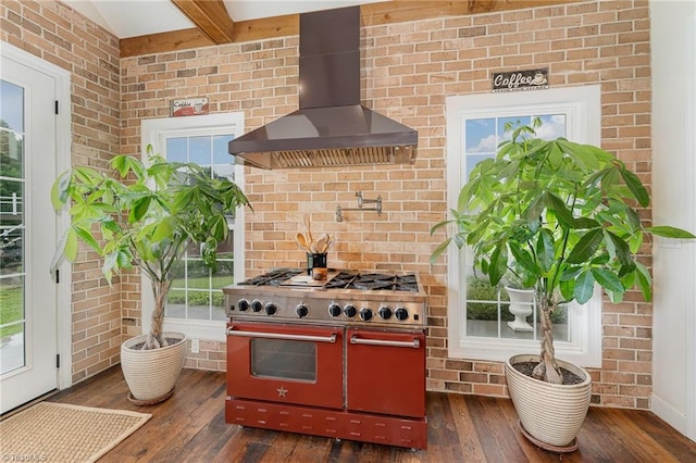 2733 Nebo Rd, East Bend, NC 27018 - kitchen featuring wall chimney exhaust hood, double oven range, hardwood / wood-style flooring, a wood stove, and beamed ceiling