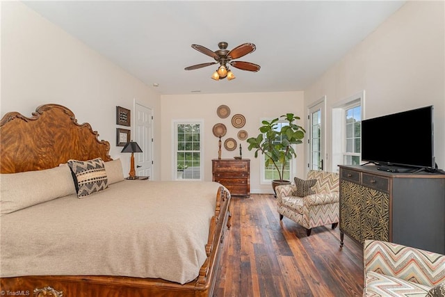 2733 Nebo Rd, East Bend, NC 27018 - bedroom with dark wood-style floors, access to outside, multiple windows, and ceiling fan