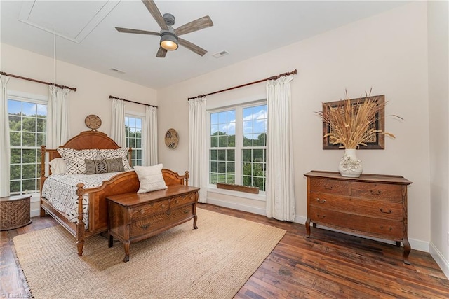 2733 Nebo Rd, East Bend, NC 27018 - bedroom featuring attic access, hardwood / wood-style floors, multiple windows, and ceiling fan