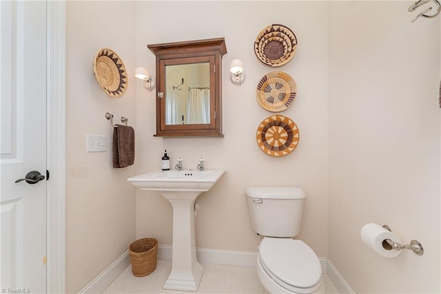 2733 Nebo Rd, East Bend, NC 27018 - full bathroom featuring toilet and baseboards