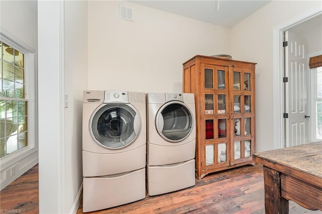 2733 Nebo Rd, East Bend, NC 27018 - washroom with wood finished floors and separate washer and dryer