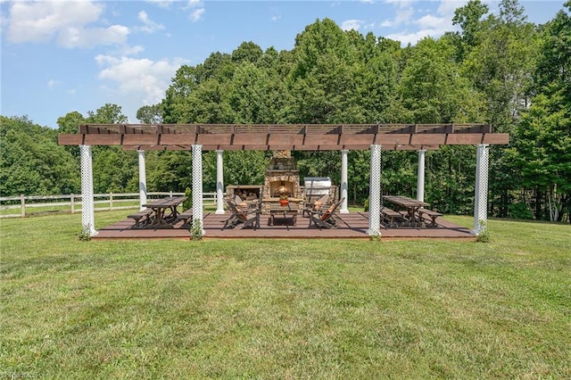 2733 Nebo Rd, East Bend, NC 27018 - view of yard with an outdoor stone fireplace, a deck, and a pergola