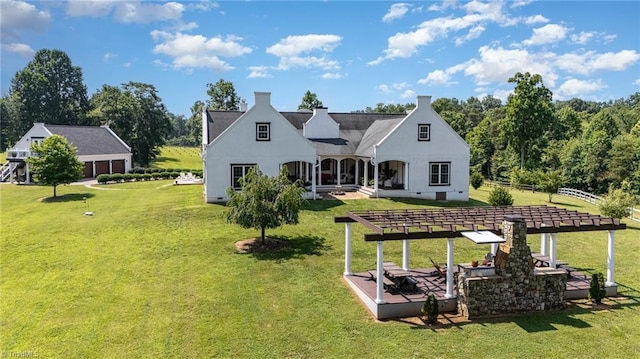 2733 Nebo Rd, East Bend, NC 27018 - back of house with a lawn, a pergola, and stucco siding