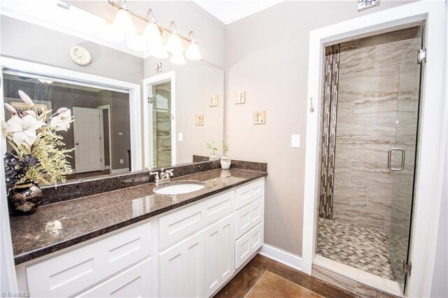 bathroom featuring a shower with shower door