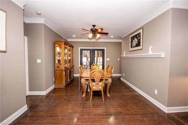 dining space featuring ceiling fan, french doors, dark hardwood / wood-style floors, and ornamental molding