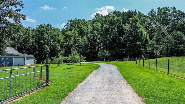 view of property's community featuring a lawn