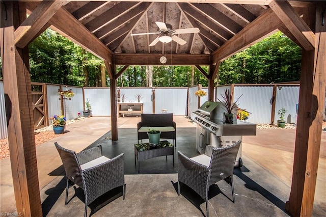 view of patio featuring ceiling fan and a gazebo