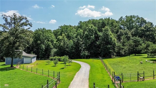 birds eye view of property featuring a rural view