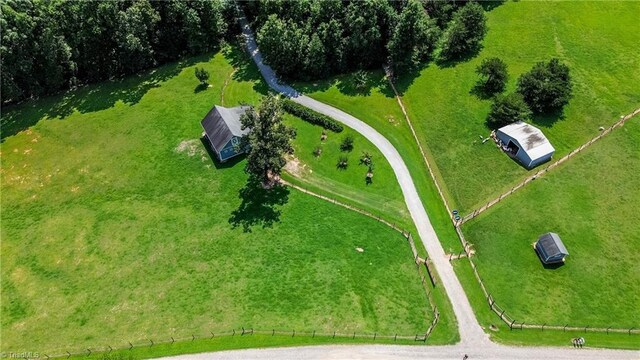 birds eye view of property with a rural view