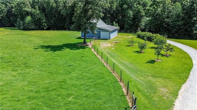 exterior space featuring an outbuilding and a lawn