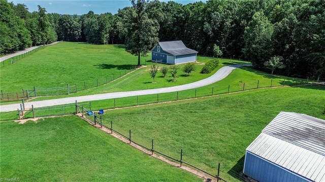 view of property's community with a yard