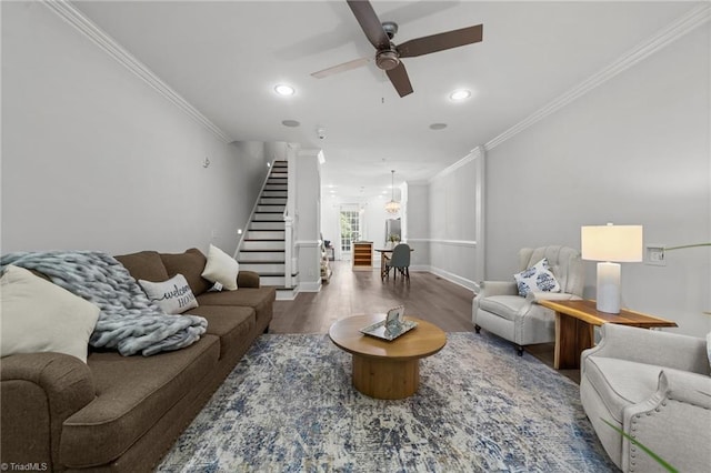 606 Bellemeade St, Greensboro, NC 27401 - living area with stairs, a ceiling fan, crown molding, wood finished floors, and a chandelier