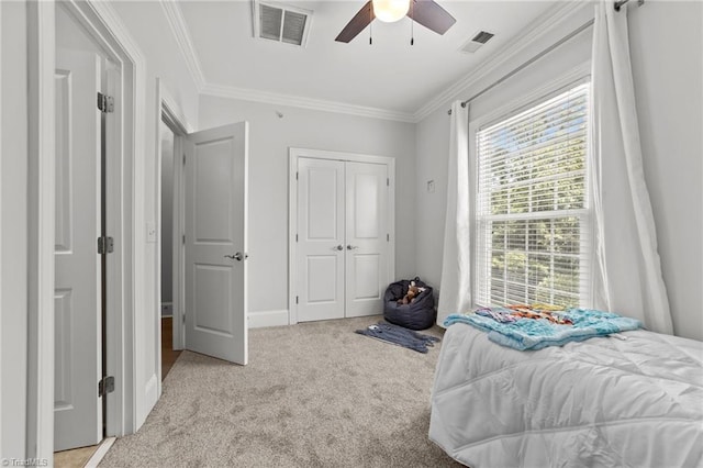 606 Bellemeade St, Greensboro, NC 27401 - bedroom with carpet floors, ornamental molding, a closet, and a ceiling fan