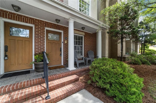 606 Bellemeade St, Greensboro, NC 27401 - property entrance with covered porch and brick siding