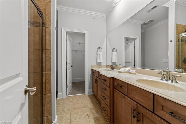606 Bellemeade St, Greensboro, NC 27401 - bathroom with a stall shower, double vanity, ornamental molding, tile patterned floors, and a walk in closet