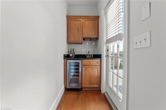 606 Bellemeade St, Greensboro, NC 27401 - indoor wet bar with beverage cooler and wood finished floors