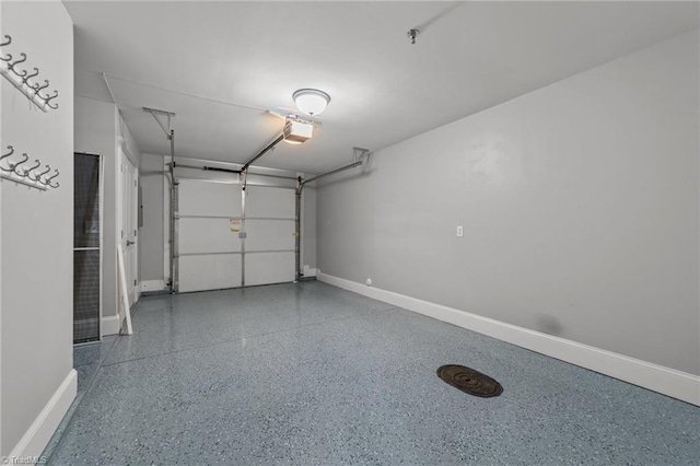 606 Bellemeade St, Greensboro, NC 27401 - garage with a garage door opener and baseboards