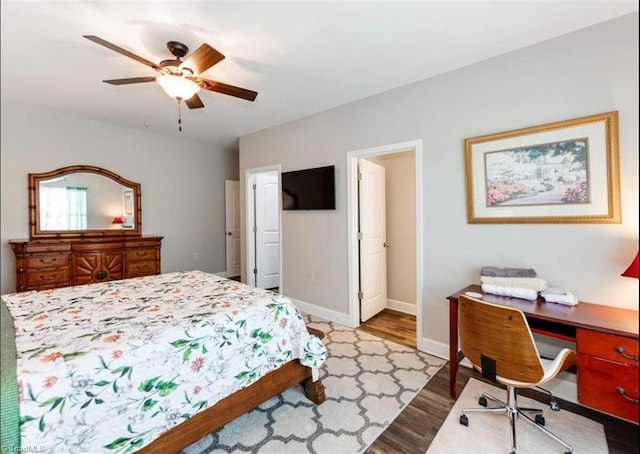 2431 Eagle Creek Ct Unit 203, Winston-Salem, NC 27103 - bedroom with baseboards, a ceiling fan, and wood finished floors