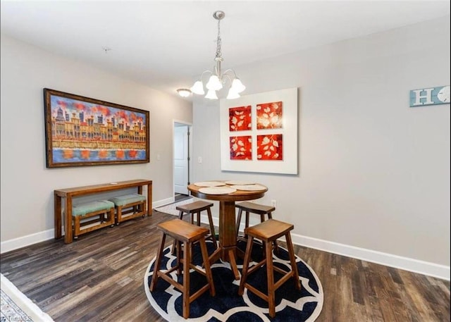 2431 Eagle Creek Ct Unit 203, Winston-Salem, NC 27103 - dining room with baseboards, dark wood finished floors, and an inviting chandelier