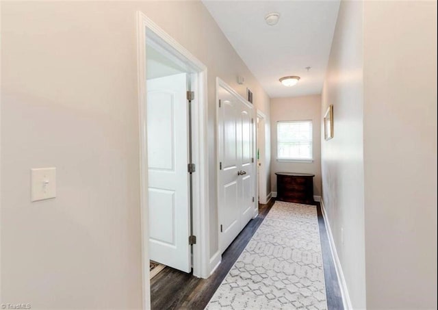 2431 Eagle Creek Ct Unit 203, Winston-Salem, NC 27103 - hall featuring baseboards, dark wood finished floors, and visible vents