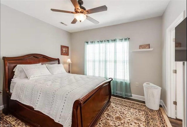 2431 Eagle Creek Ct Unit 203, Winston-Salem, NC 27103 - bedroom with ceiling fan, baseboards, visible vents, and wood finished floors
