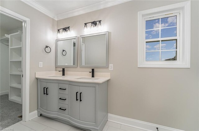 bathroom with tile patterned floors, vanity, and ornamental molding