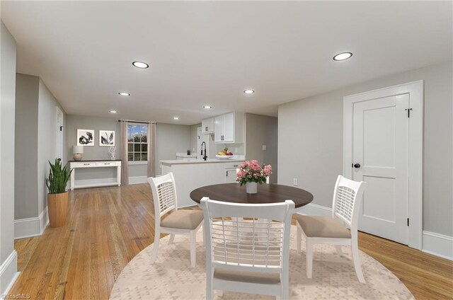 dining space with light wood-type flooring