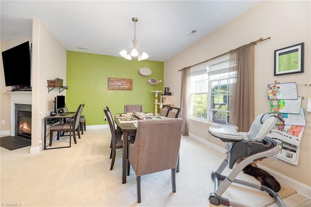 1720 Timber Cove Ct, Winston-Salem, NC 27127 - dining area featuring a fireplace with flush hearth, baseboards, carpet, and visible vents