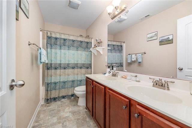 1720 Timber Cove Ct, Winston-Salem, NC 27127 - bathroom featuring double vanity, toilet, visible vents, and a sink
