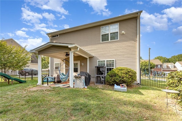 1720 Timber Cove Ct, Winston-Salem, NC 27127 - rear view of property with a fenced backyard, a ceiling fan, and a yard
