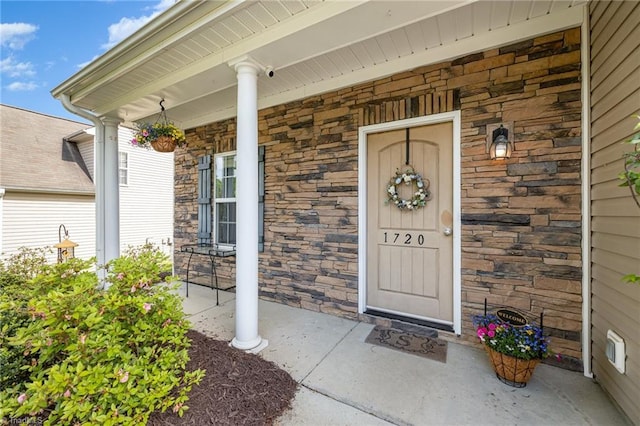 1720 Timber Cove Ct, Winston-Salem, NC 27127 - view of exterior entry with covered porch and stone siding