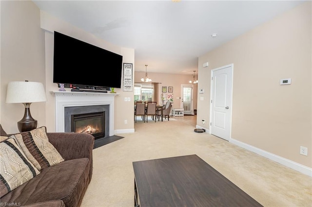 1720 Timber Cove Ct, Winston-Salem, NC 27127 - carpeted living area featuring an inviting chandelier, a fireplace with flush hearth, and baseboards