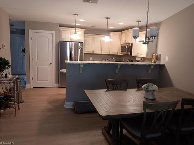 dining area with light wood-type flooring