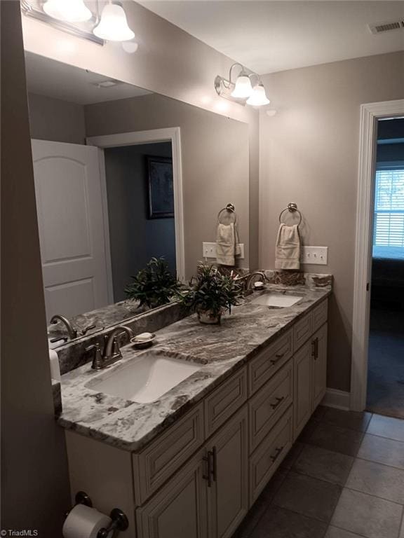 bathroom featuring tile patterned floors and vanity