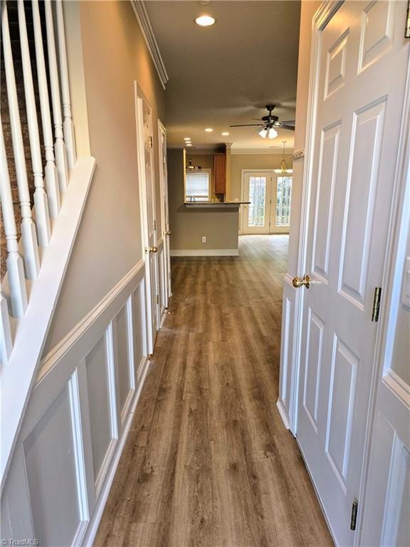 hall featuring dark hardwood / wood-style floors and crown molding